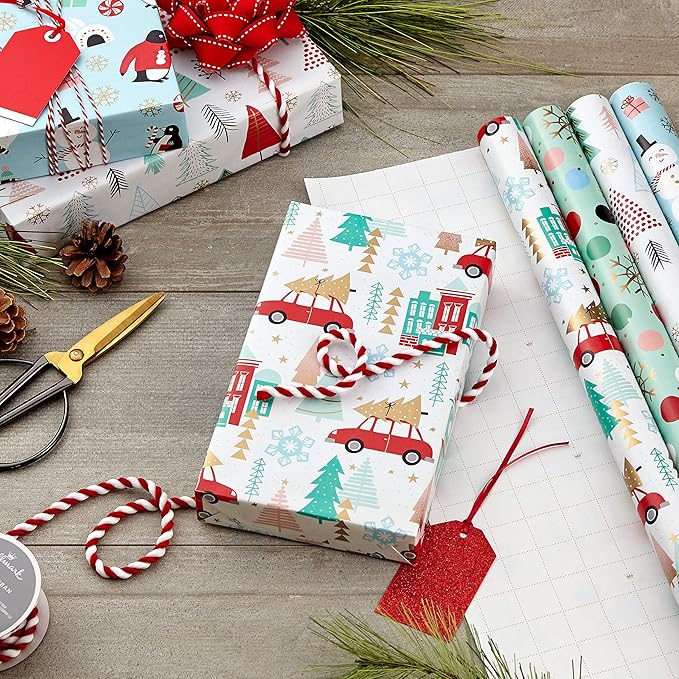Hallmark Holiday Wrapping Paper Bundle with Cut Lines on Reverse, Quirky Christmas (Pack of 4, 120 sq. ft. ttl) Yeti, Santa, Penguin, Snowflakes, Blue, Gold